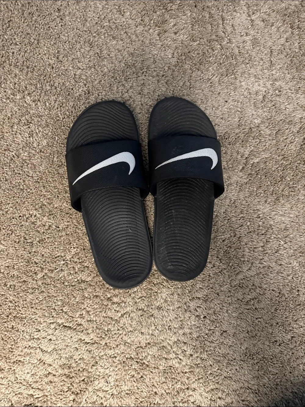 Nike Kids Black Slide Sandals with White Swoosh Logo
